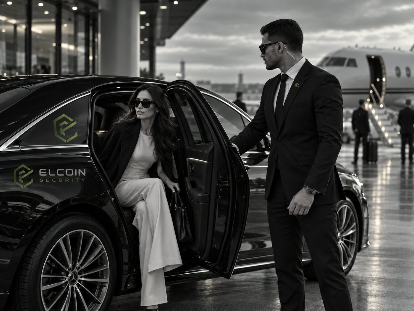 ELCOIN executive protection officer assisting a client at a private jet